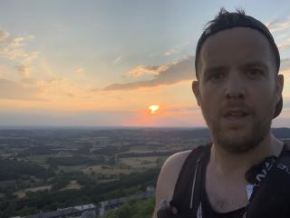 Bram looking very tired, with a Morvan sunset in the background